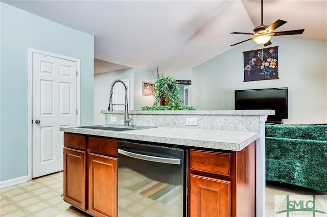 kitchen featuring lofted ceiling, a sink, light countertops, dishwasher, and light floors