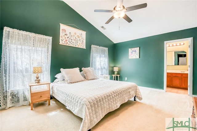 bedroom featuring visible vents, carpet flooring, connected bathroom, ceiling fan, and high vaulted ceiling