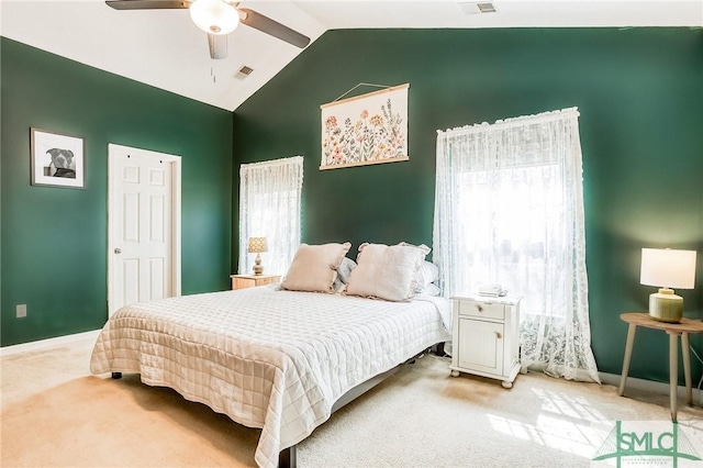 carpeted bedroom with ceiling fan, high vaulted ceiling, multiple windows, and visible vents