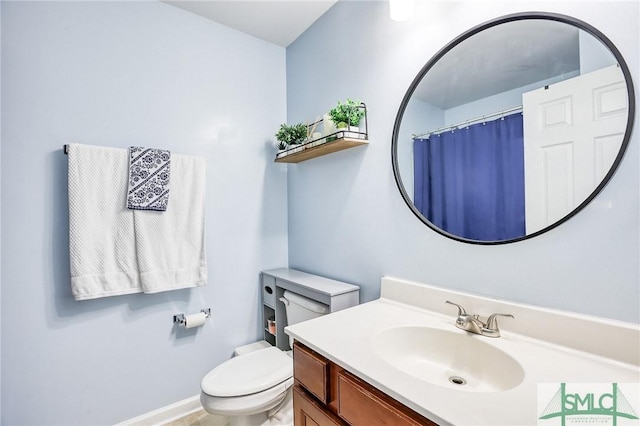 bathroom with vanity and toilet