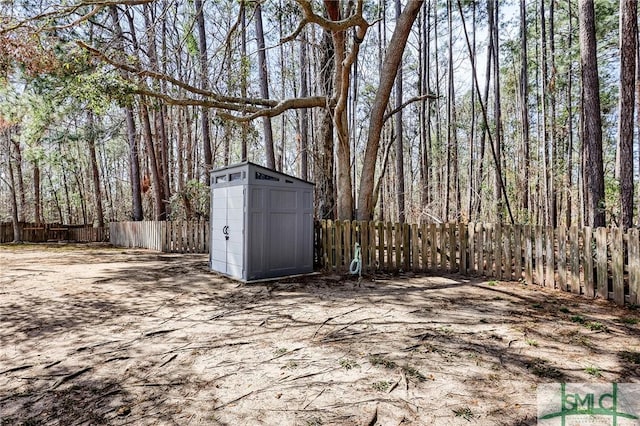 view of shed with a fenced backyard