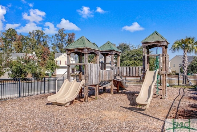 communal playground featuring fence