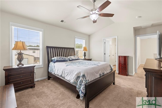 bedroom with lofted ceiling, baseboards, visible vents, and light colored carpet