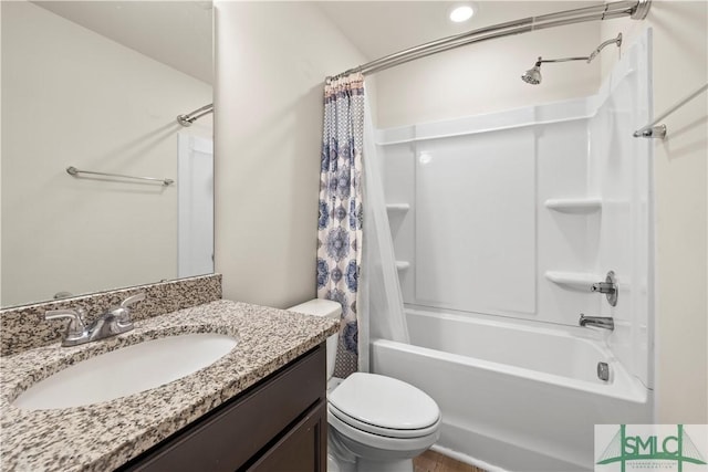 bathroom featuring toilet, shower / bathtub combination with curtain, and vanity