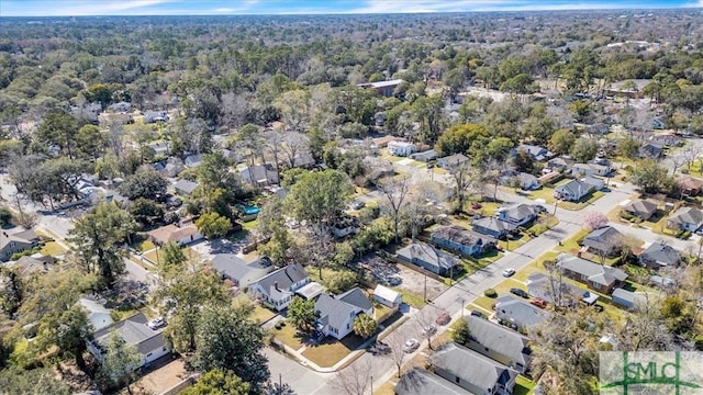 aerial view featuring a residential view and a view of trees