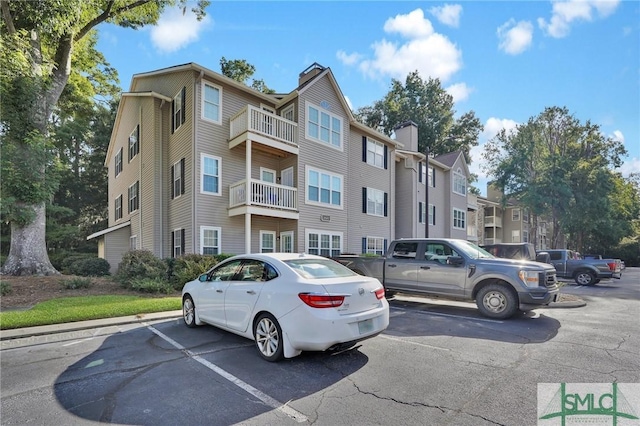 view of property with uncovered parking