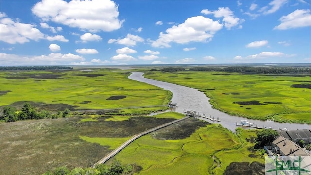 drone / aerial view with a rural view and a water view