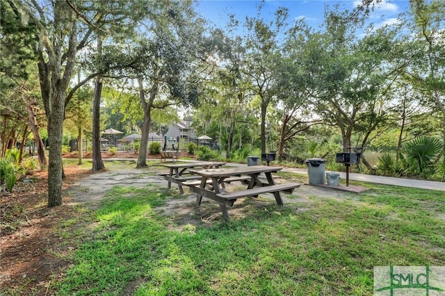 view of home's community featuring a lawn