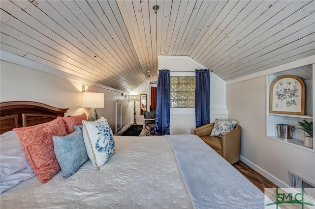 bedroom with lofted ceiling, wood ceiling, visible vents, and baseboards