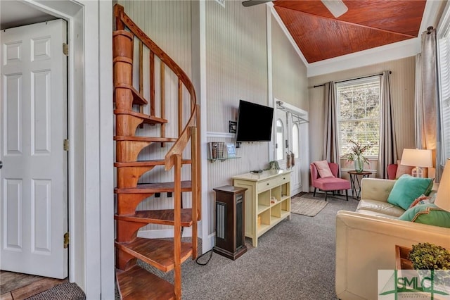 carpeted living area featuring wooden ceiling, stairs, ornamental molding, and vaulted ceiling