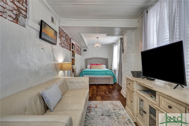 bedroom with dark wood-style flooring