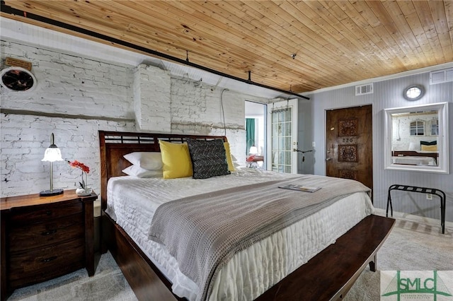 bedroom with wooden ceiling and visible vents