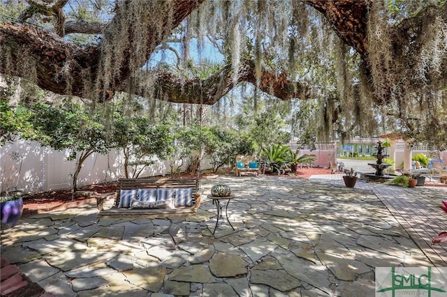 view of patio / terrace with a fenced backyard and an outdoor living space