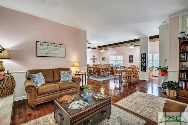 living area featuring ornamental molding and hardwood / wood-style flooring