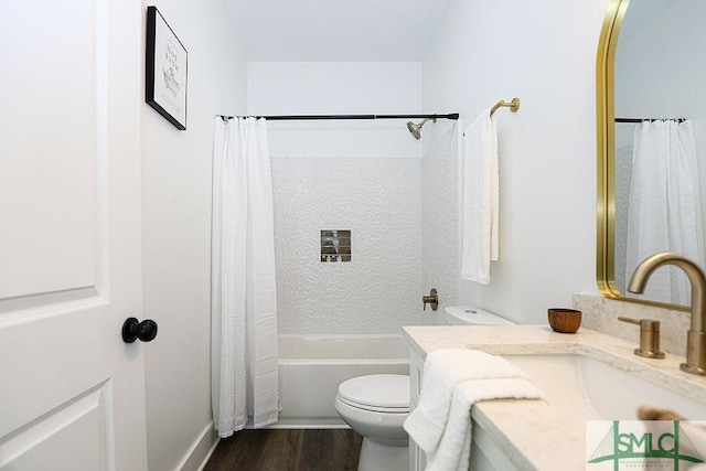 full bath with wood finished floors, shower / bath combo, vanity, and toilet