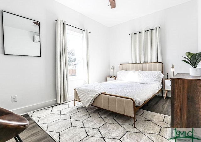 bedroom with light wood-style floors, baseboards, and a ceiling fan