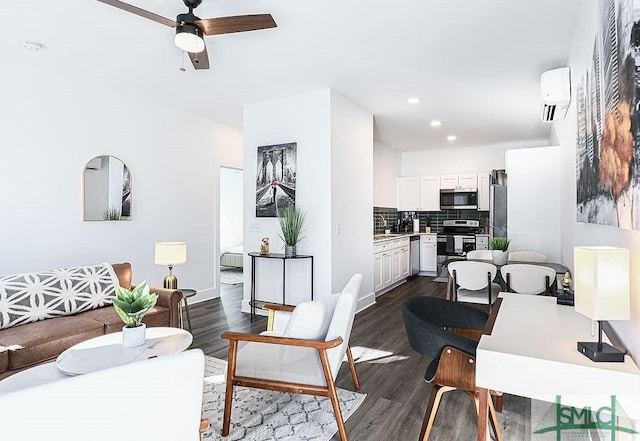 living room featuring ceiling fan, dark wood-type flooring, and recessed lighting