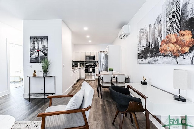 interior space featuring recessed lighting, baseboards, dark wood-style flooring, and a wall mounted AC