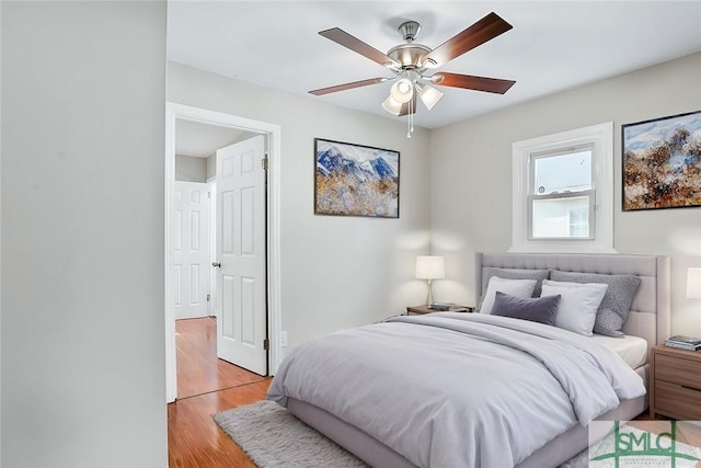 bedroom featuring ceiling fan and light wood-style flooring