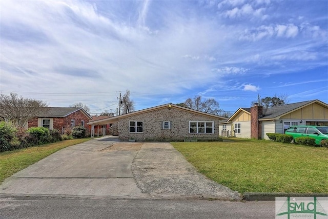 ranch-style home featuring a front yard, concrete driveway, and brick siding