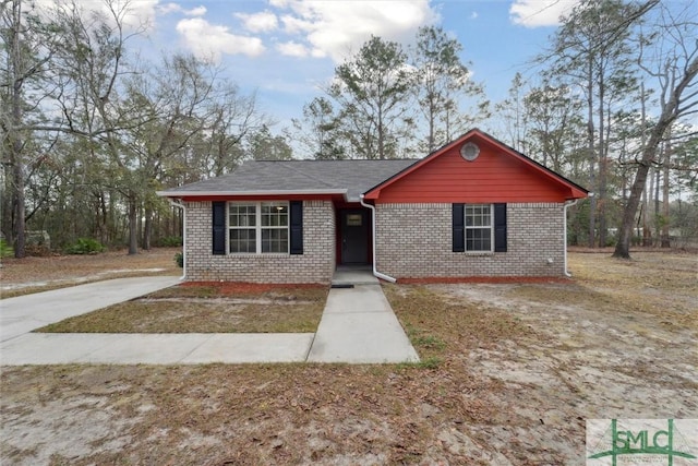 view of front of home featuring brick siding