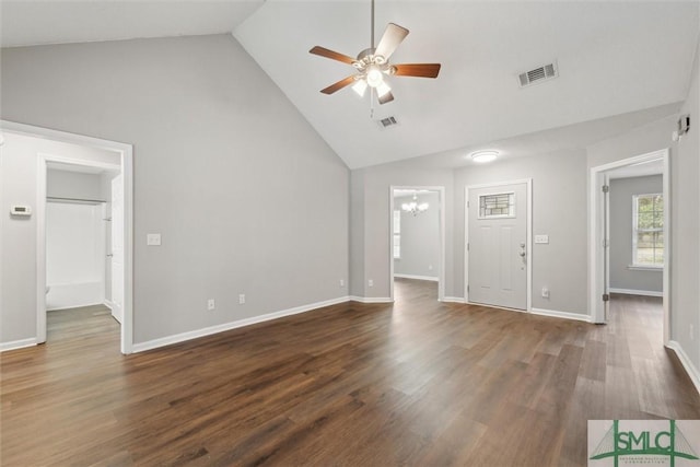 unfurnished living room with high vaulted ceiling, ceiling fan with notable chandelier, wood finished floors, visible vents, and baseboards