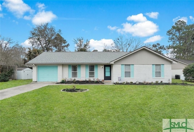 single story home featuring a front lawn, concrete driveway, brick siding, and an attached garage