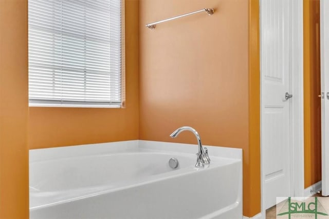 full bathroom with a bath