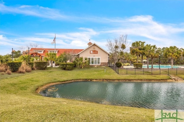property view of water featuring fence