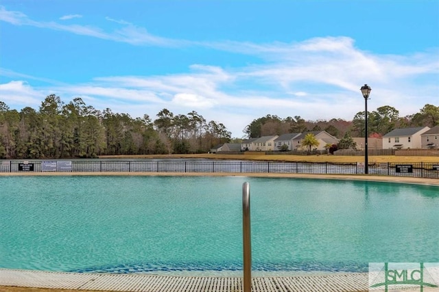 view of pool with fence