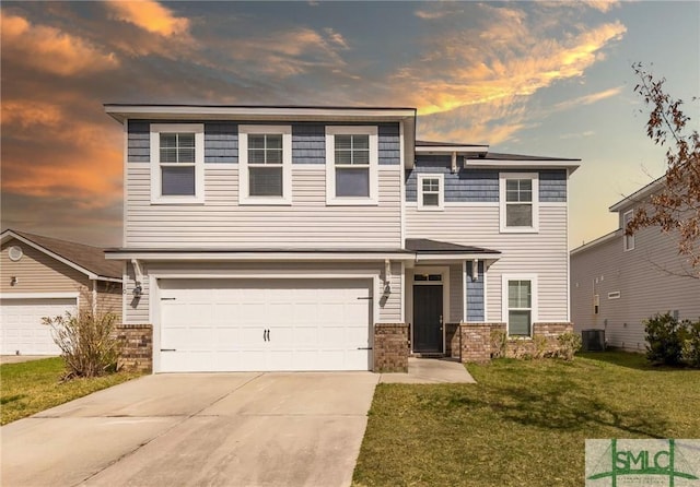 view of front facade featuring central air condition unit, an attached garage, driveway, and a front lawn