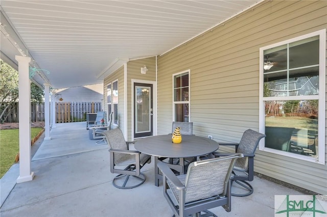 view of patio / terrace with outdoor dining space and fence