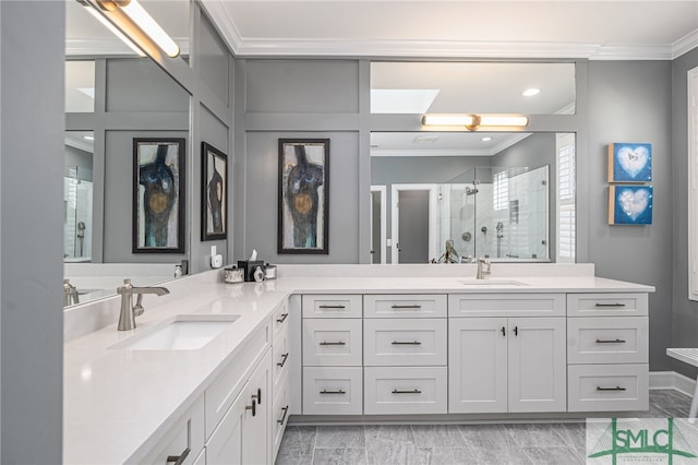 full bath featuring crown molding, a stall shower, and a sink