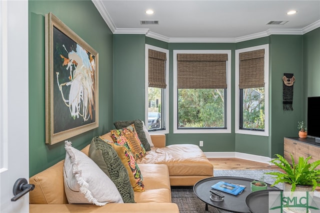 sitting room featuring visible vents, wood finished floors, crown molding, and recessed lighting