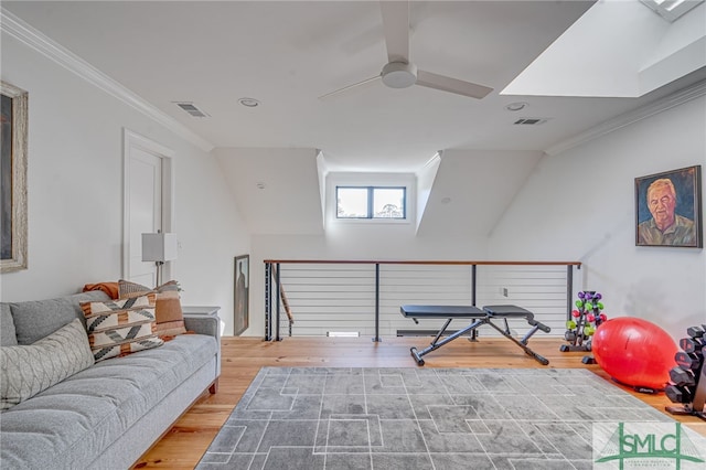 interior space featuring ornamental molding, visible vents, and wood finished floors