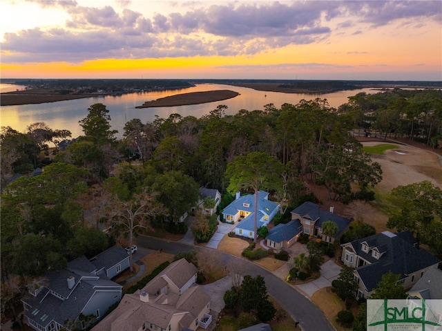 birds eye view of property with a water view and a residential view