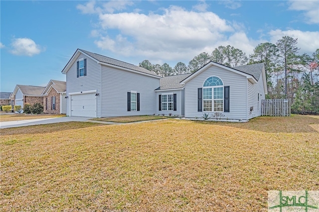 view of front facade featuring a garage, concrete driveway, and a front yard