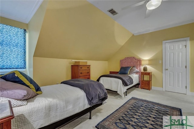 carpeted bedroom with ceiling fan, visible vents, vaulted ceiling, and crown molding