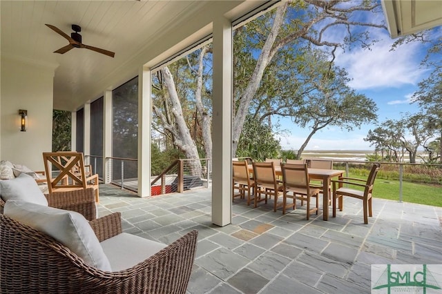 sunroom with ceiling fan