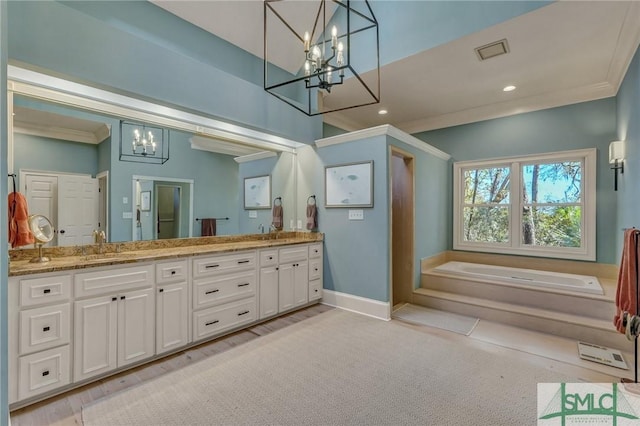 full bathroom with double vanity, ornamental molding, a garden tub, and baseboards