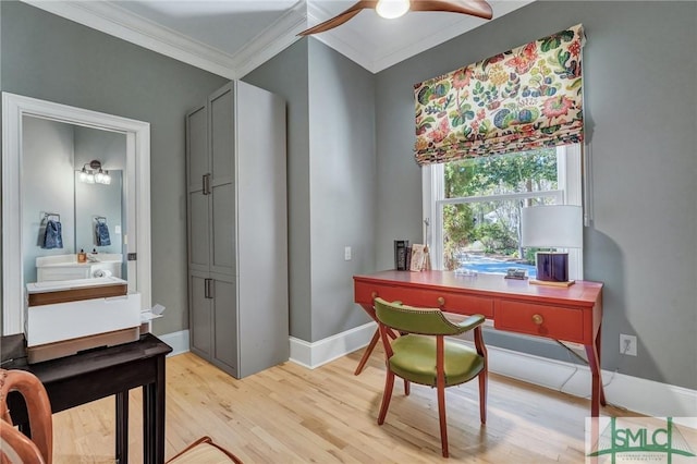 home office with light wood-type flooring, baseboards, and ornamental molding