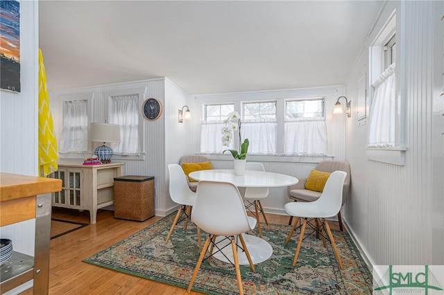 dining room featuring baseboards and wood finished floors