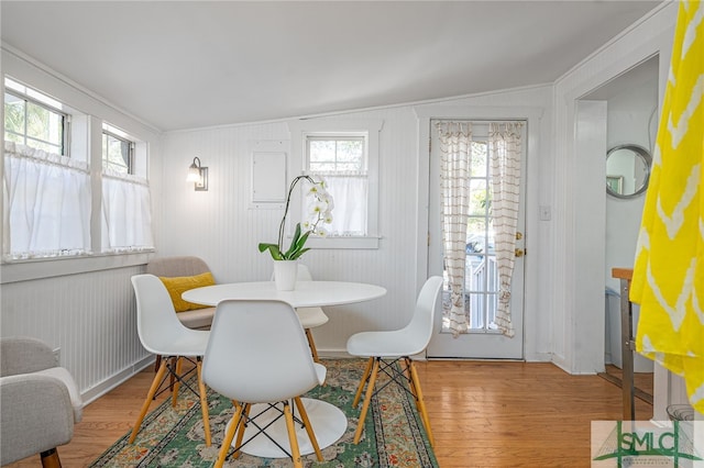 dining area with wood finished floors