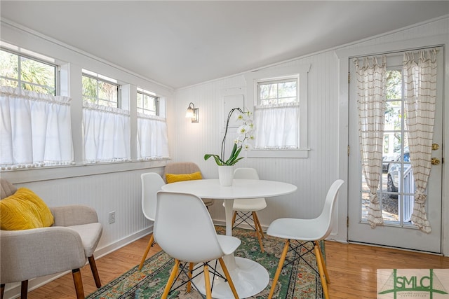 dining space with wood finished floors