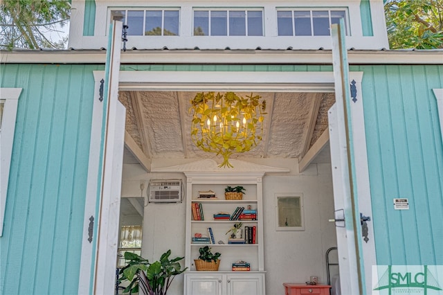 doorway to property with a wall unit AC