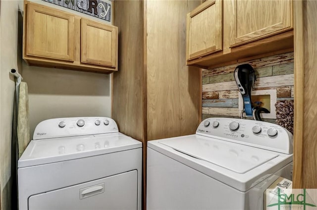 laundry area featuring cabinet space and separate washer and dryer