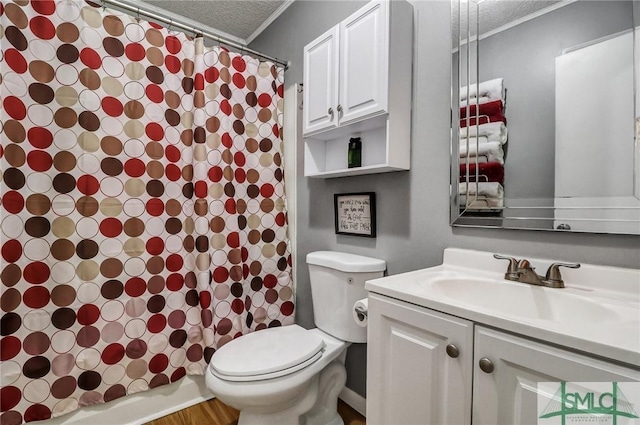 full bathroom featuring ornamental molding, a textured ceiling, toilet, and vanity