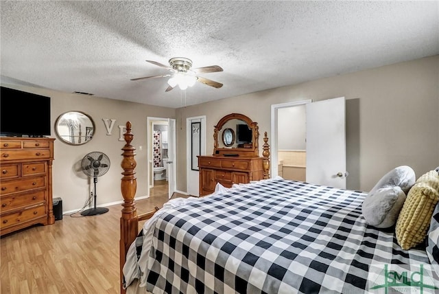 bedroom with baseboards, visible vents, a ceiling fan, a textured ceiling, and light wood-type flooring