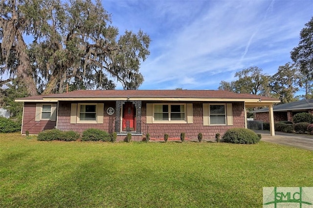 ranch-style home featuring a front yard, driveway, and an attached carport