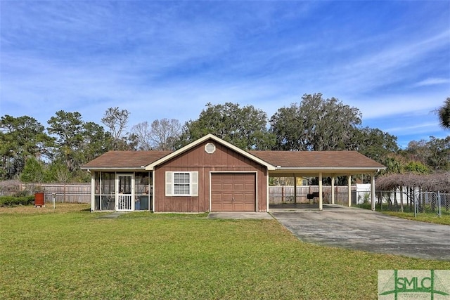 single story home featuring a garage, fence, driveway, a carport, and a front lawn